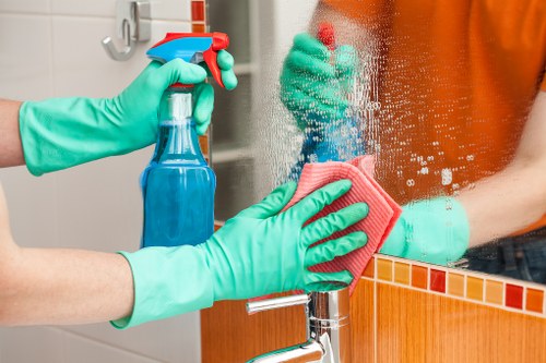 Kitchen surface being cleaned during house cleaning