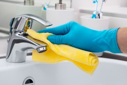 Technician performing deep mattress cleaning with equipment