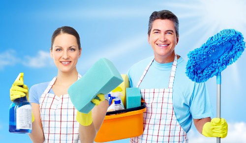 Bedroom domestic cleaning with neatly made bed and dust-free surfaces